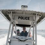 A state police boat patrolling for sharks off the coast of Robert Moses Beach on Long Island.